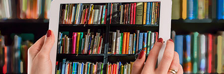 A tablet displaying books on shelves