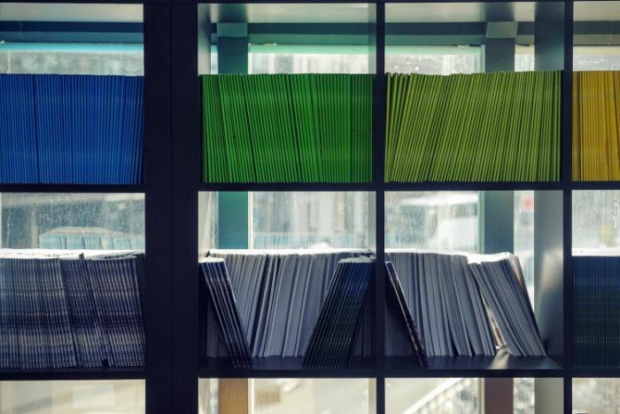 Documents on a bookshelf