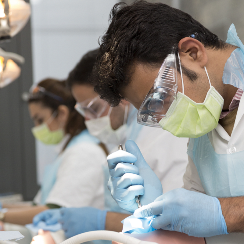 Dentistry student group with phantom heads in lab